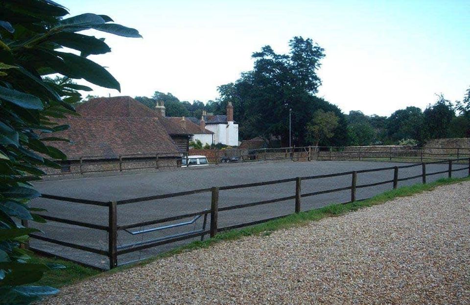 Arena beside farmhouse