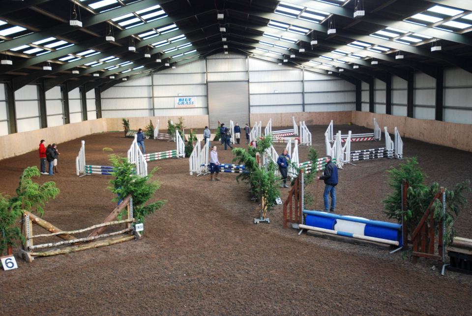 Indoor arena with jumps