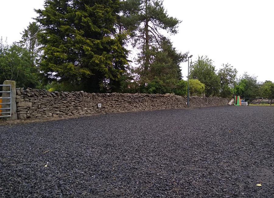 Outdoor arena with stone wall