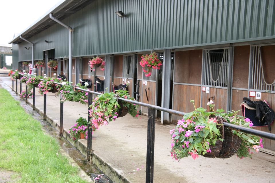 Stable block with flower baskets
